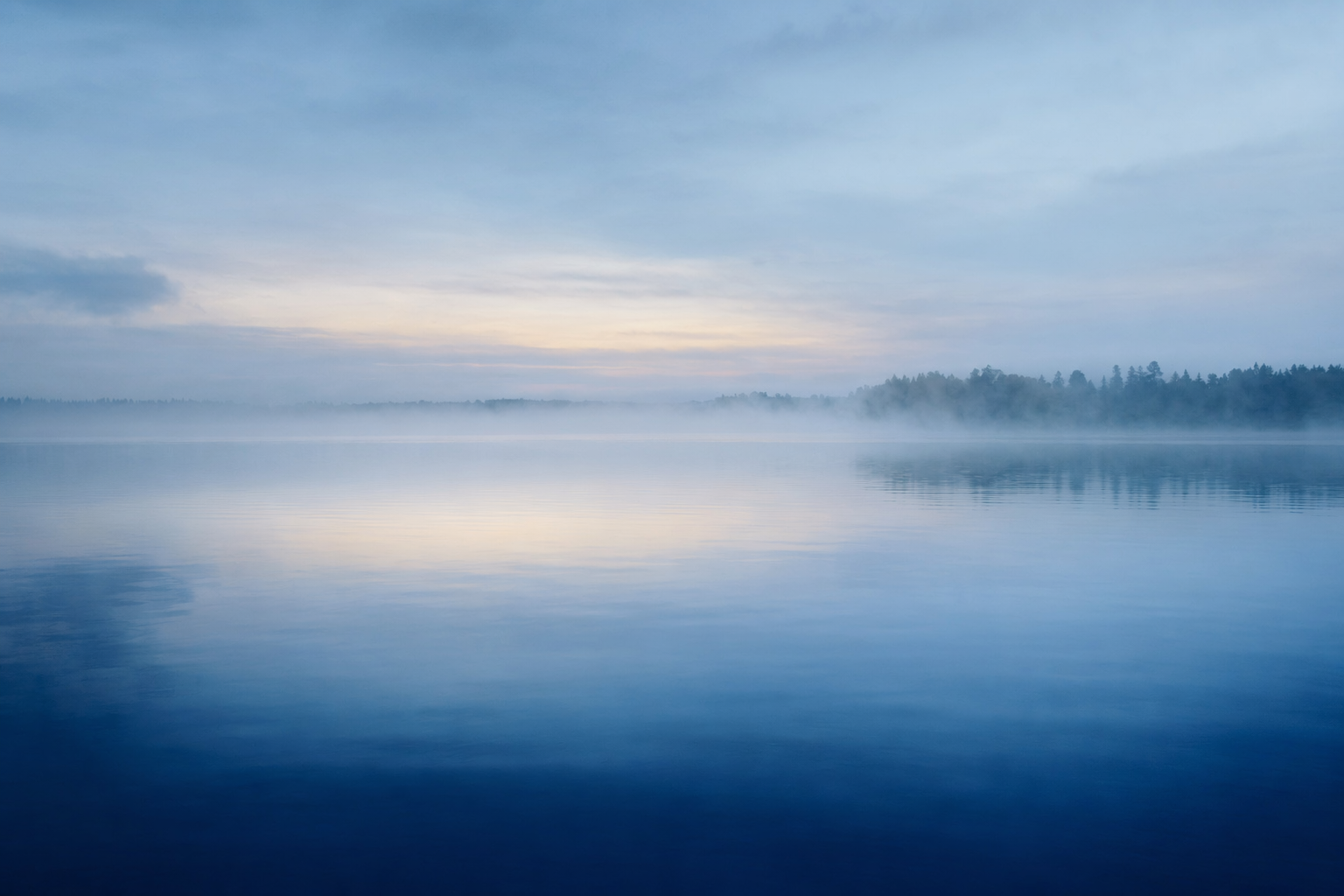 Misty still water at dawn